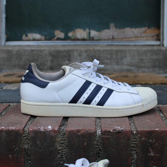 white and navy shell toe adidas
